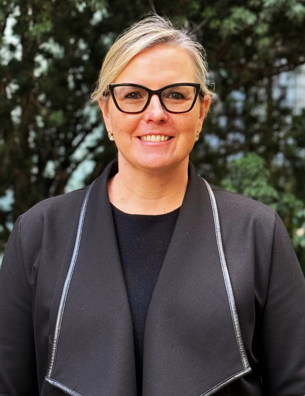 A headshot of Georgy Grundy, director of Funding Operations and Monitoring