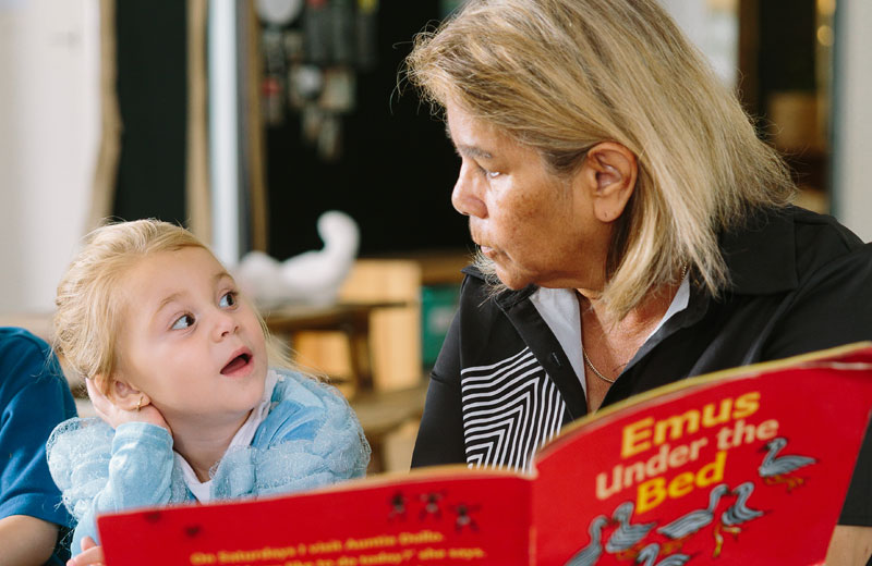 An educator with a child